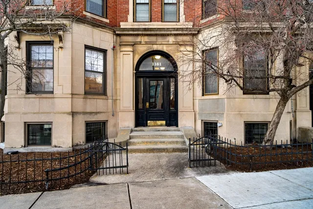 a view of a white building with many windows