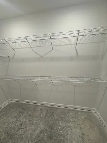 a view of a room with racks on the wall