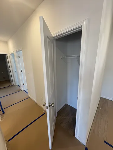 a bathroom with a double vanity sink a toilet and a mirror