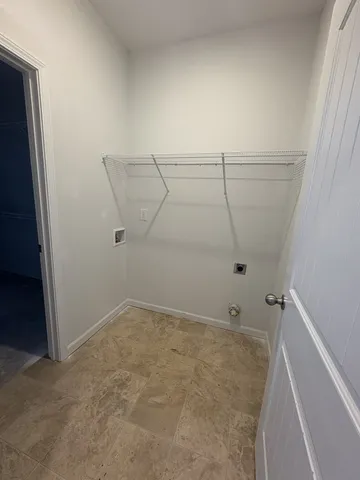 a view of room with window and ceiling fan