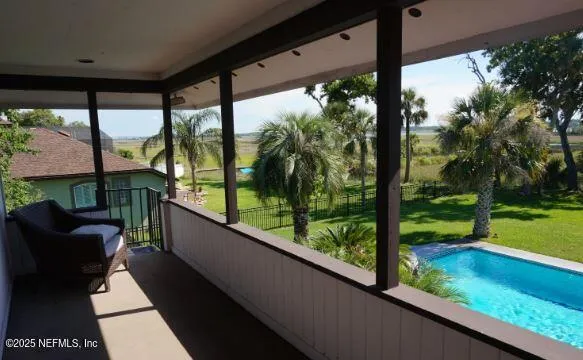 a view of a house with a door and wooden floor