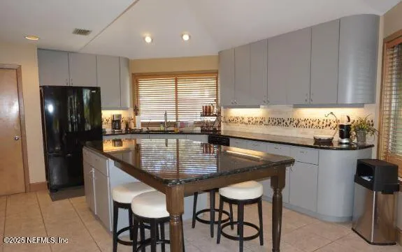 a bedroom with bed and a window