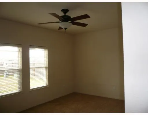 a view of a window in an empty room