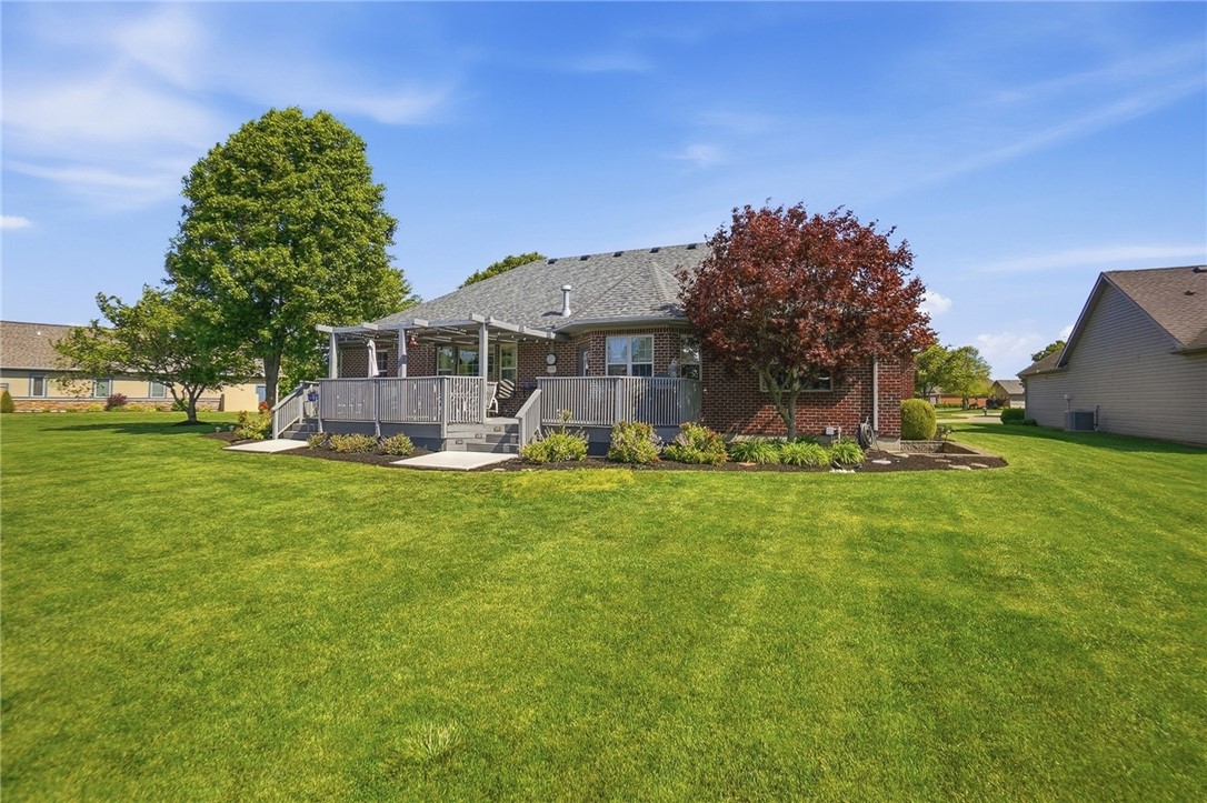 710 Governors Road Troy, OH 45373 - Photo 49 of 56 This residence features an expansive deck for outdoor enjoyment and a meticulously landscaped yard.