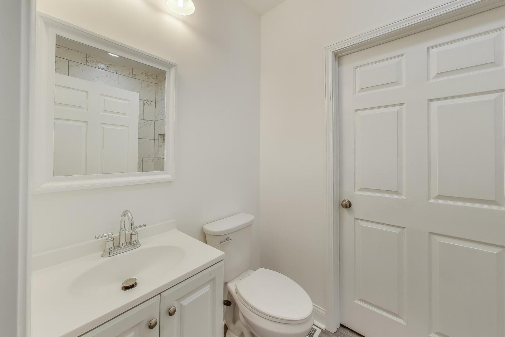 Undisclosed Address Chicago, IL 60622 - Photo 15 of 33 a bathroom with a sink a toilet and shower