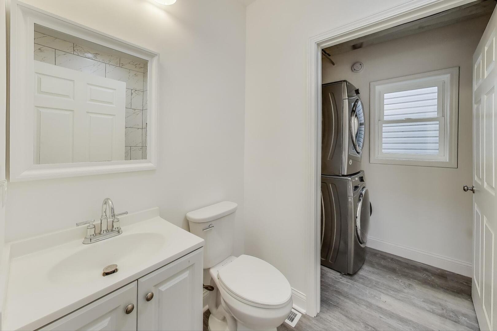 Undisclosed Address Chicago, IL 60622 - Photo 17 of 33 a white toilet sitting next to a bathroom sink
