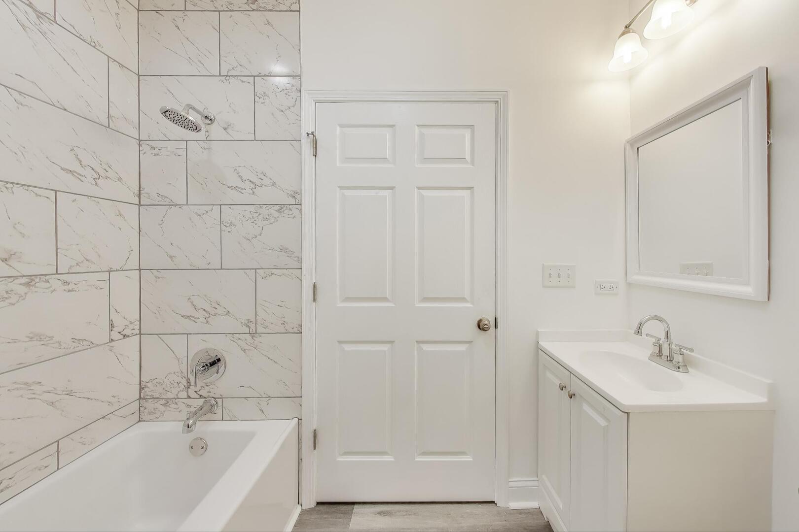 Undisclosed Address Chicago, IL 60622 - Photo 18 of 33 a bathroom with a bathtub and a sink