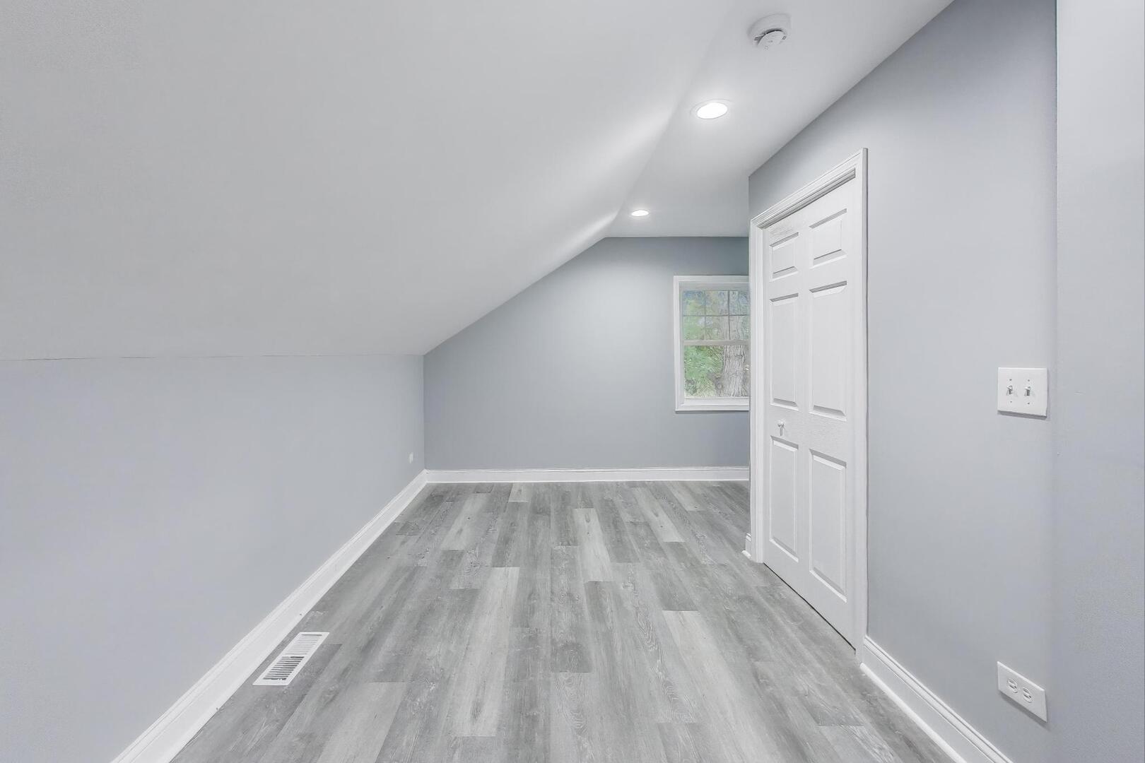 Undisclosed Address Chicago, IL 60622 - Photo 24 of 33 wooden floor in an empty room with a window