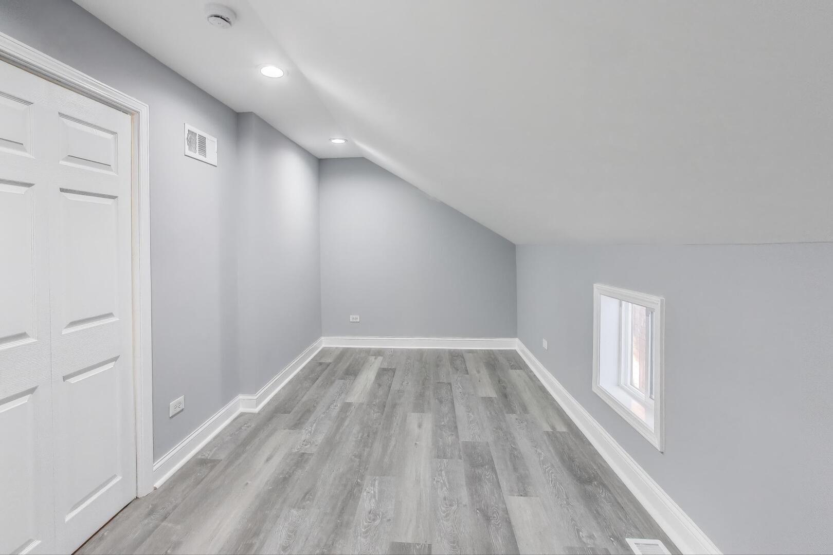 Undisclosed Address Chicago, IL 60622 - Photo 26 of 33 a view of empty room with wooden floor and fan