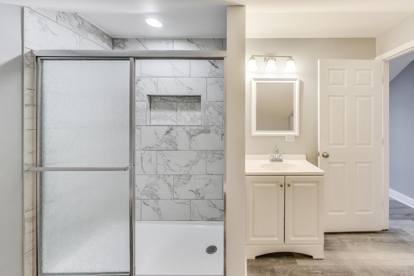 Undisclosed Address Chicago, IL 60622 - Photo 28 of 33 a bathroom with a shower and a sink