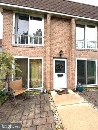 a front view of a house with a large window