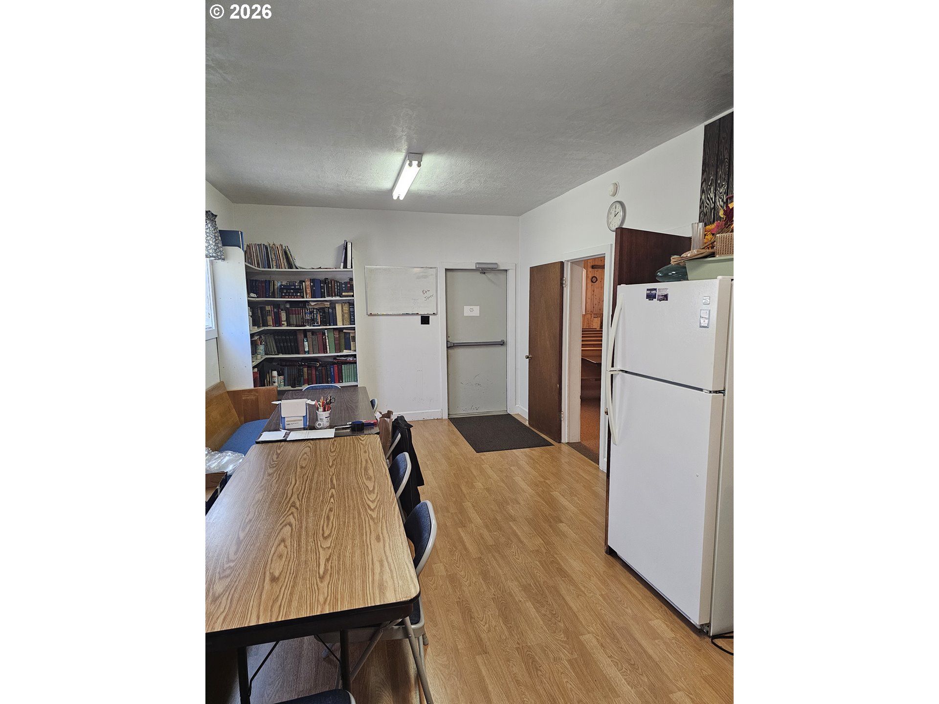595 11th Street Southwest Bandon, OR 97411 - Photo 19 of 28 a living room with furniture and a refrigerator