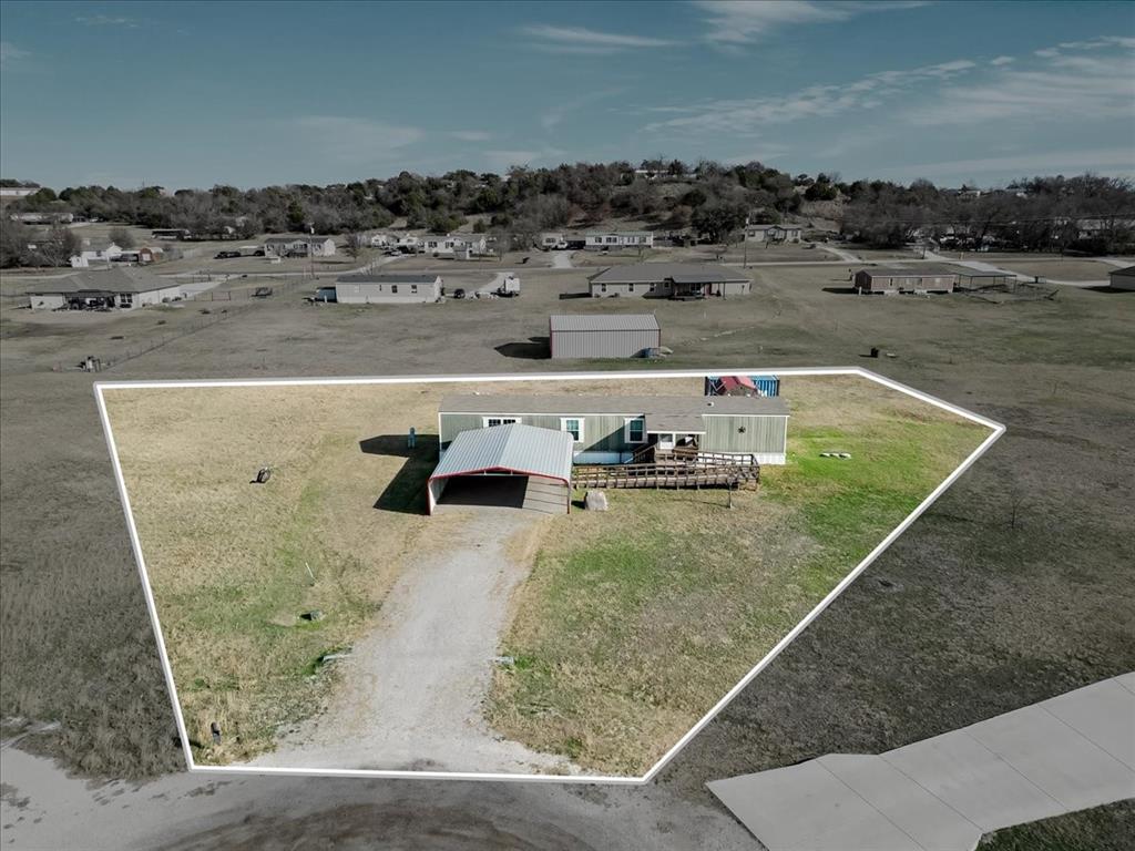 126 Starry Sky Court Springtown, TX 76082 - Photo 1 of 34 Aerial view of property and surrounding area featuring property boundaries highlighted