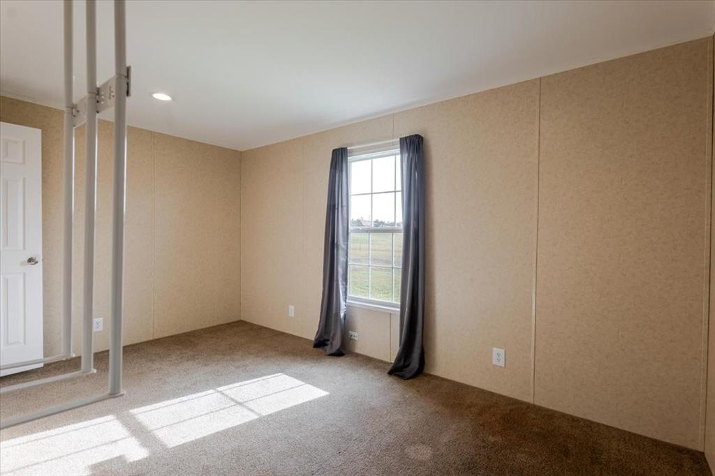 126 Starry Sky Court Springtown, TX 76082 - Photo 16 of 34 Bedroom with carpet floors and recessed lighting