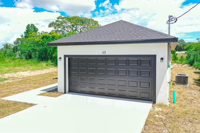 a front view of a house with a garage
