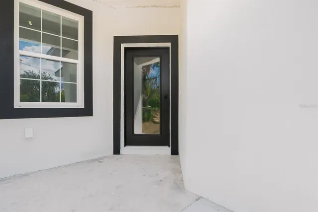a view of an empty room with a window