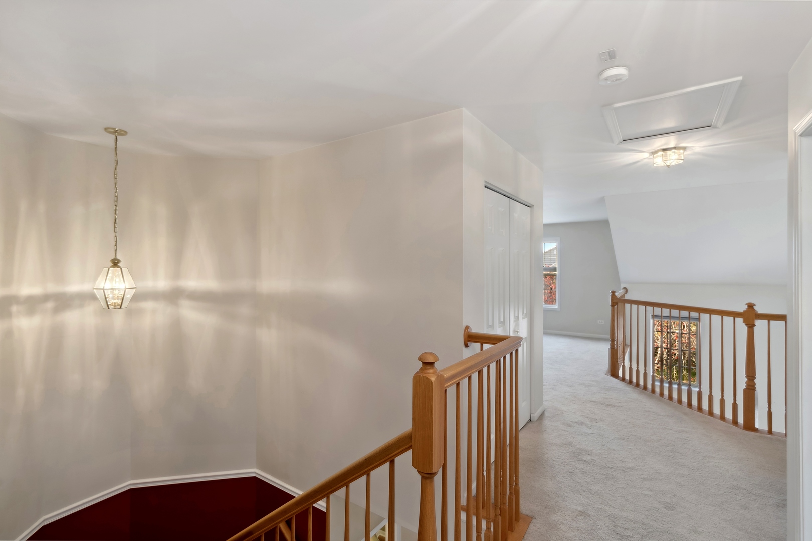 5471 McDonough Road Hoffman Estates, IL 60192 - Photo 19 of 32 a view of a hallway with stairs