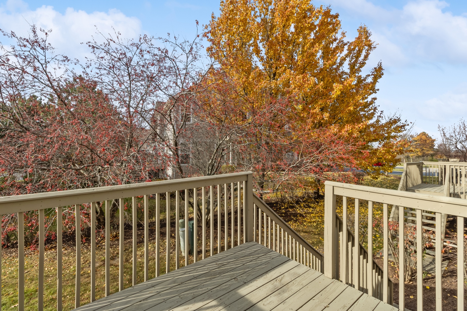 5471 McDonough Road Hoffman Estates, IL 60192 - Photo 26 of 32 a view of balcony with wooden floor and fence