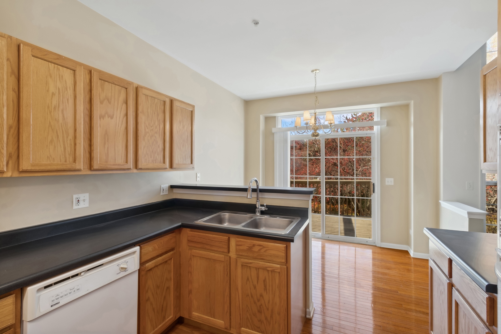5471 McDonough Road Hoffman Estates, IL 60192 - Photo 10 of 32 a kitchen with granite countertop a sink and a stove