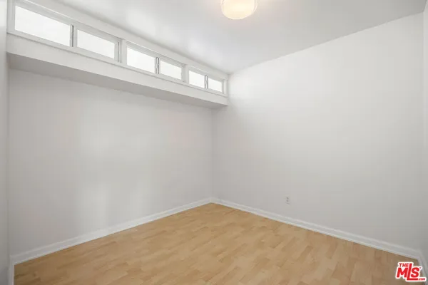 a bathroom with a sink a mirror and a window