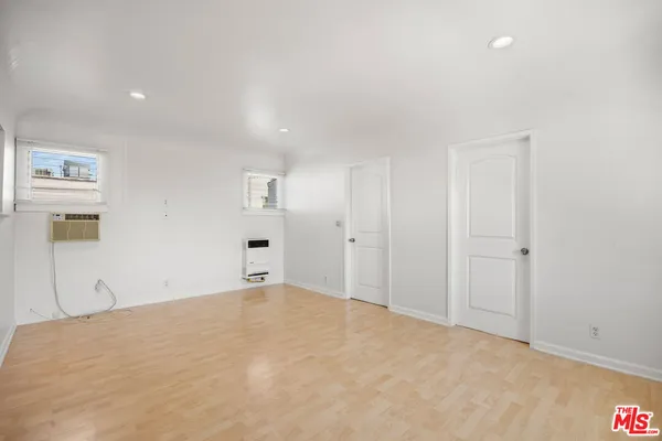 a view of a room with a bed