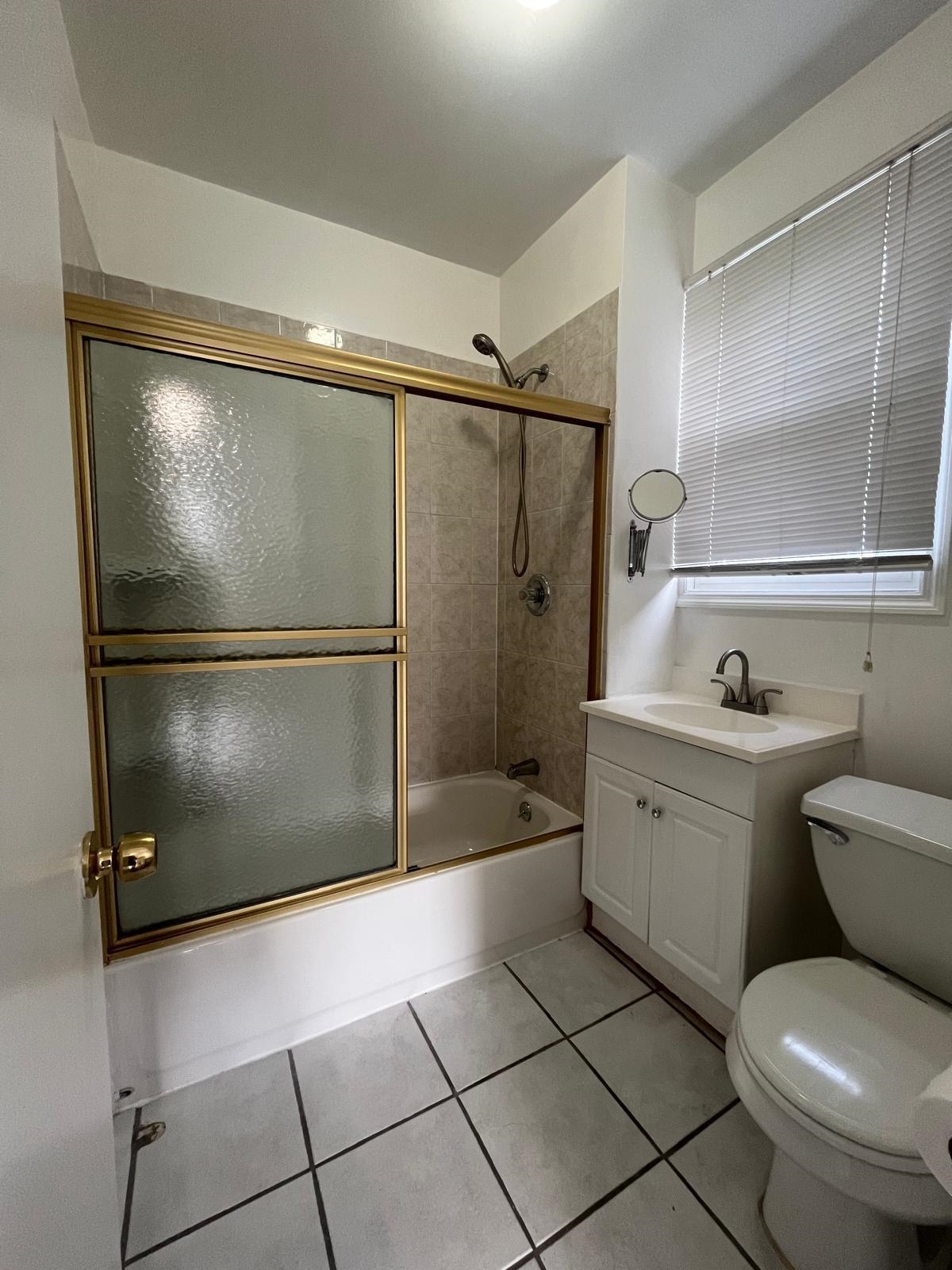 88 Devon Terrace, Unit 2 Kearny, NJ 07032 - Photo 13 of 13 a bathroom with a granite countertop sink toilet and shower