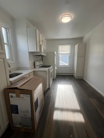 a view of a kitchen with a sink cabinets and a window