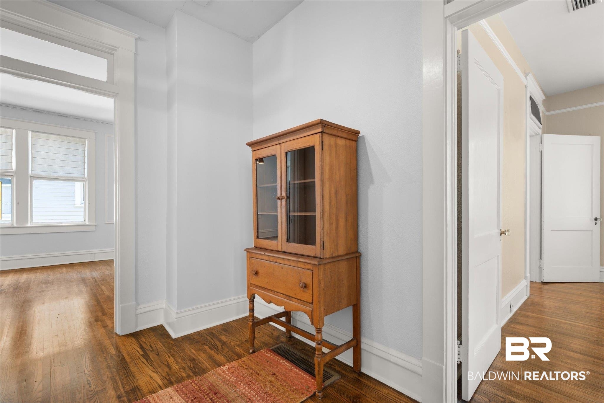 24 Macy Place Mobile, AL 36604 - Photo 21 of 38 Hallway with dark wood finished floors and baseboards