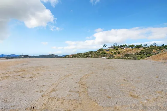 a view of a road with a building in the background
