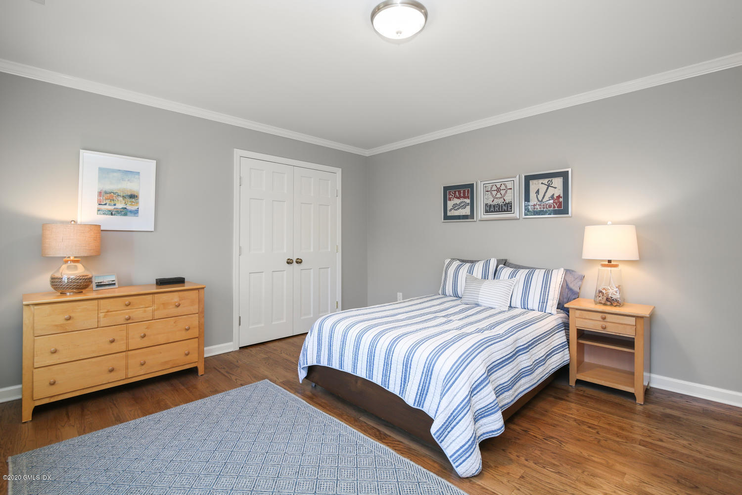 22 Normandy Lane Riverside, CT 06878 - Photo 22 of 34 a bedroom with a bed and a night stand