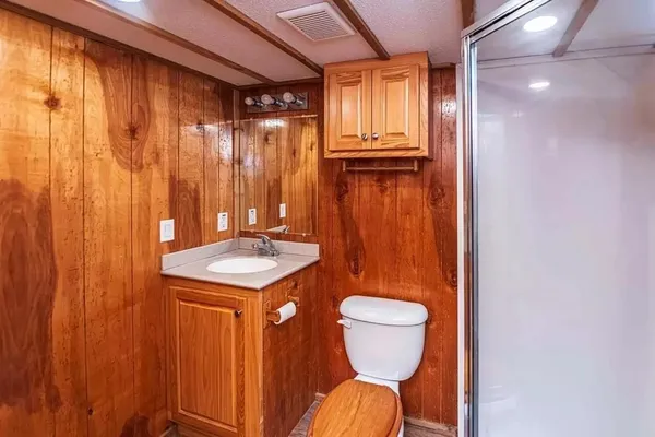 a bathroom with a toilet a sink and tub