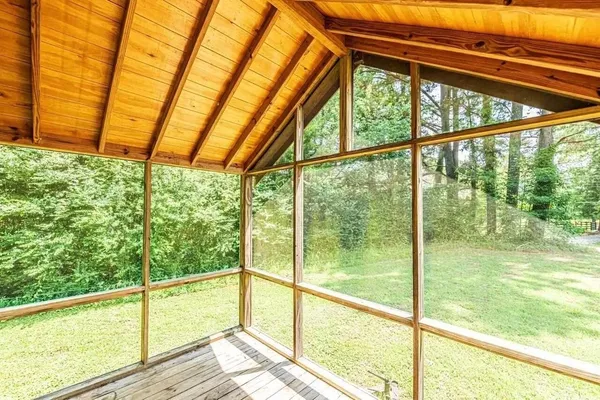 a view of an empty room with a large window