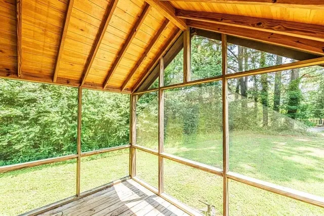 a view of an empty room with a large window