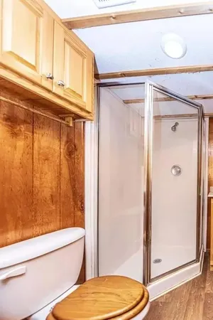 a bathroom with a shower and a toilet