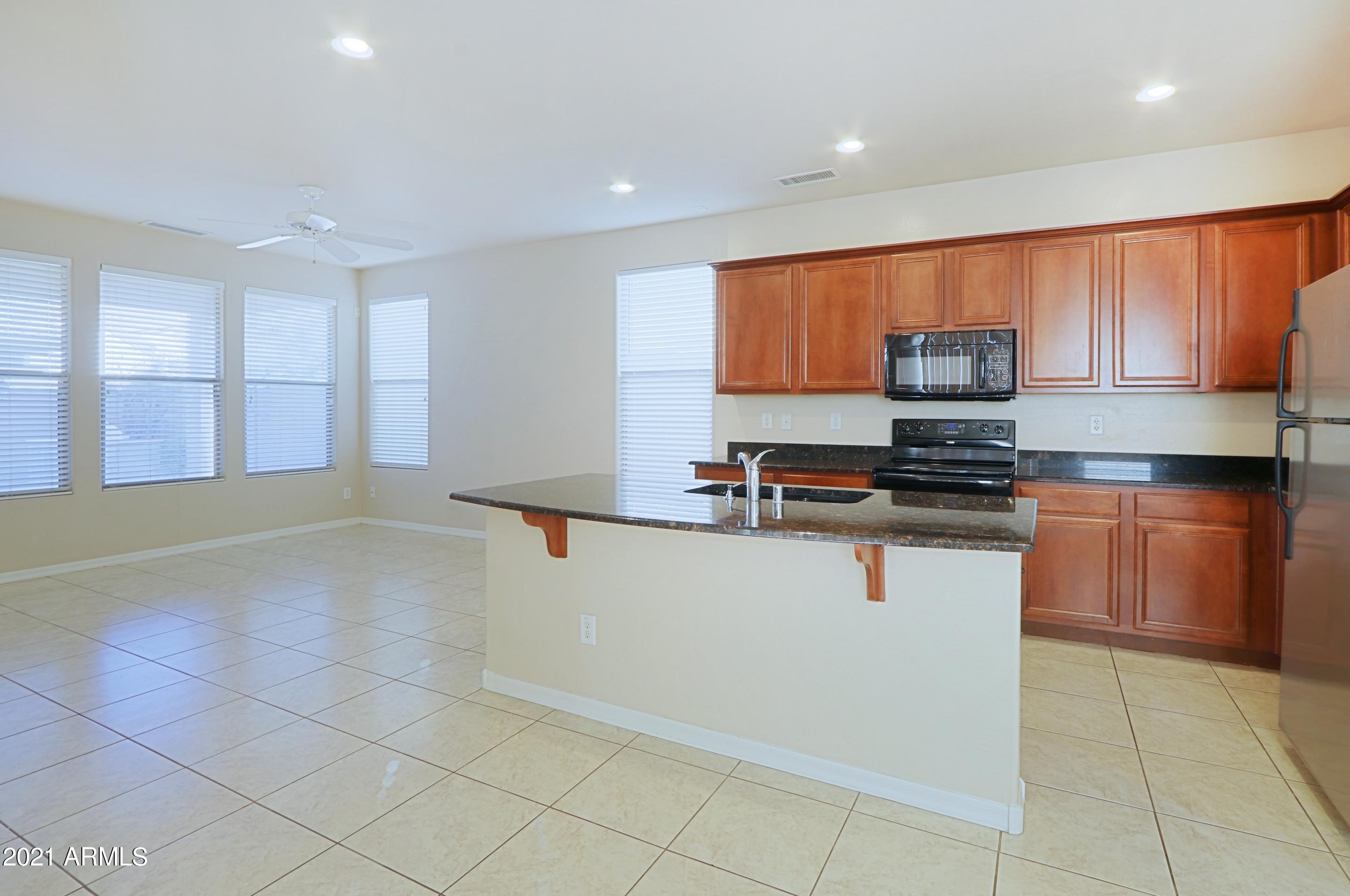 3416 West Florimond Road Phoenix, AZ 85086 - Photo 5 of 41 Family Room and Kitchen