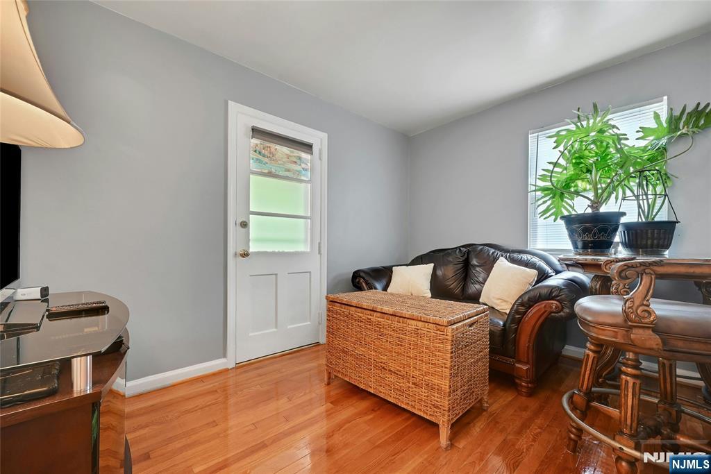 85 Edison Street Clifton, NJ 07013 - Photo 15 of 28 a living room with furniture and a potted plant