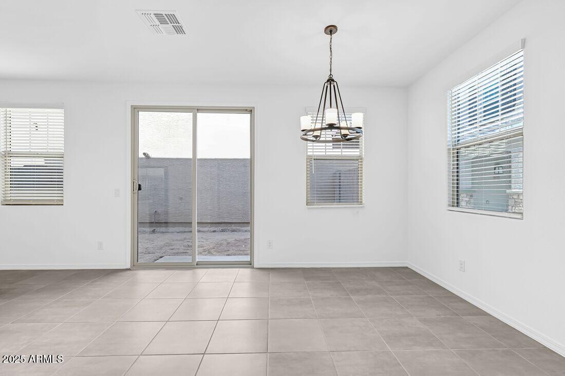 9964 West Piccadilly Road Avondale, AZ 85392 - Photo 11 of 52 a view of empty room with windows