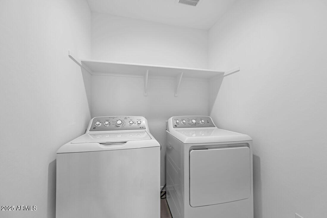 9964 West Piccadilly Road Avondale, AZ 85392 - Photo 21 of 52 a utility room with dryer and washer