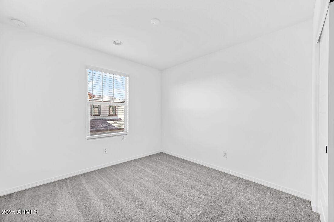 9964 West Piccadilly Road Avondale, AZ 85392 - Photo 30 of 52 an empty room with a window
