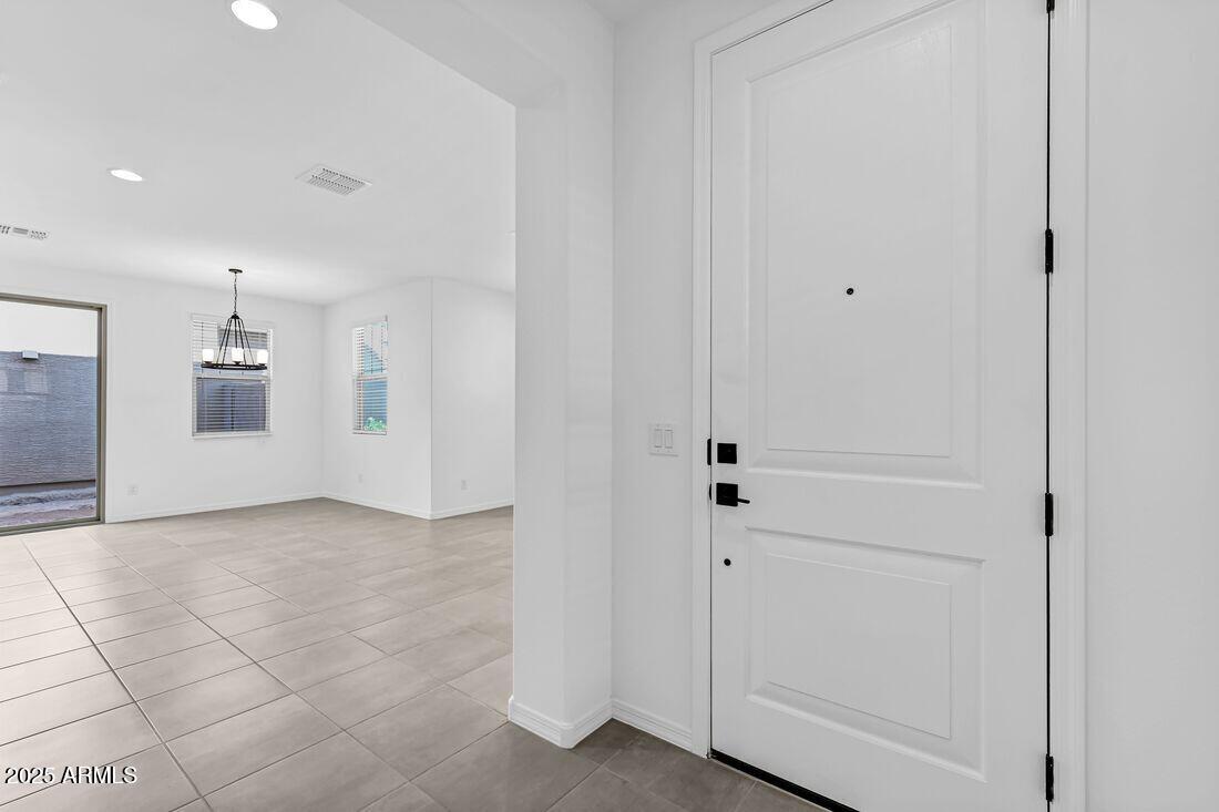 9964 West Piccadilly Road Avondale, AZ 85392 - Photo 32 of 52 a view of a hallway with closet