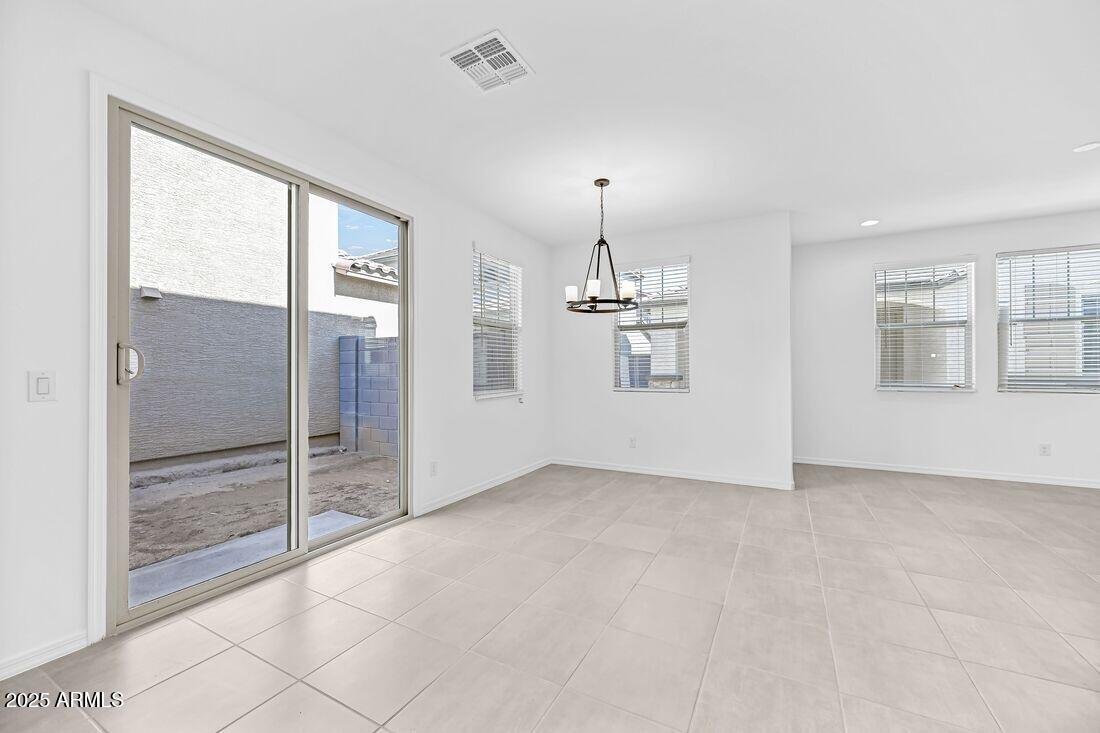 9964 West Piccadilly Road Avondale, AZ 85392 - Photo 33 of 52 an empty room with windows and entryway