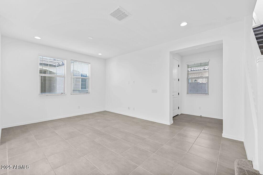 9964 West Piccadilly Road Avondale, AZ 85392 - Photo 9 of 52 an empty room with windows and closet