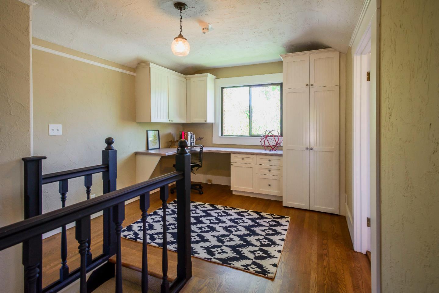 1601 Broadway Burlingame, CA 94010 - Photo 13 of 23 a kitchen with stainless steel appliances a window and cabinets