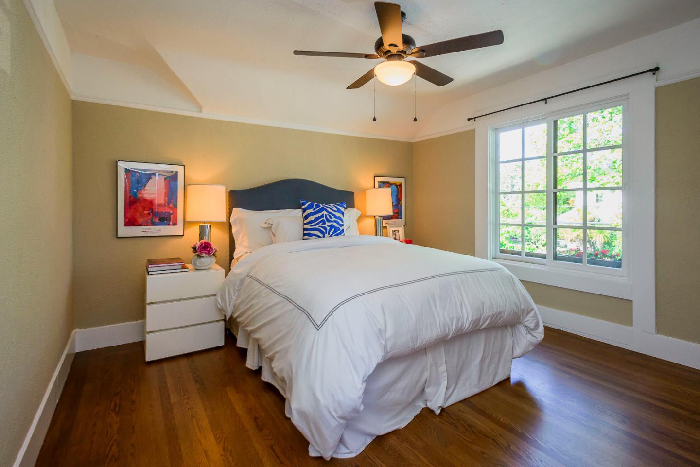 1601 Broadway Burlingame, CA 94010 - Photo 14 of 23 a bed room with a bed and a chandelier