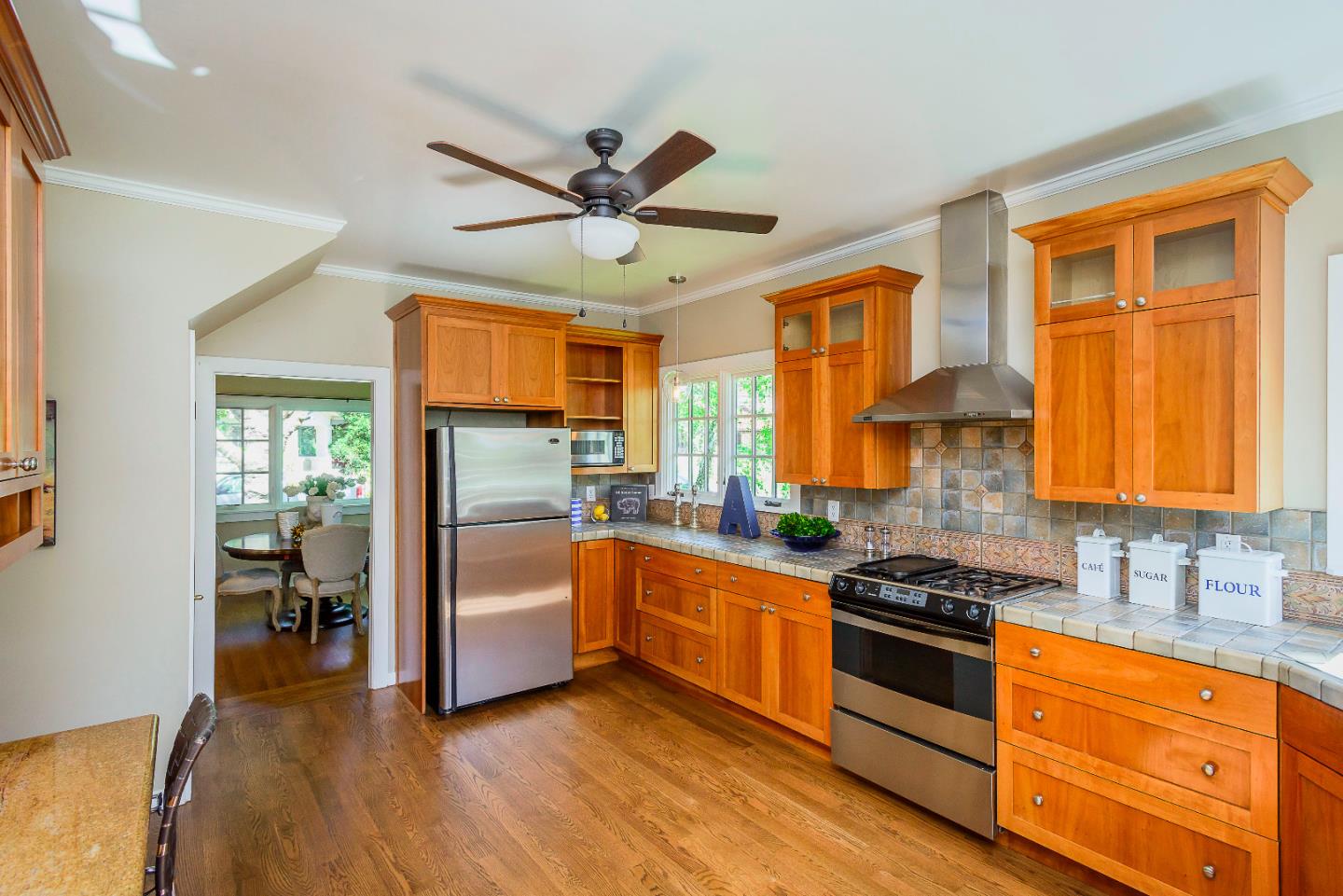 1601 Broadway Burlingame, CA 94010 - Photo 7 of 23 a kitchen with stainless steel appliances a stove a sink and a refrigerator