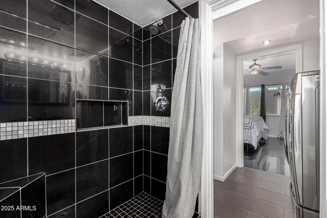 a bathroom with a glass shower door