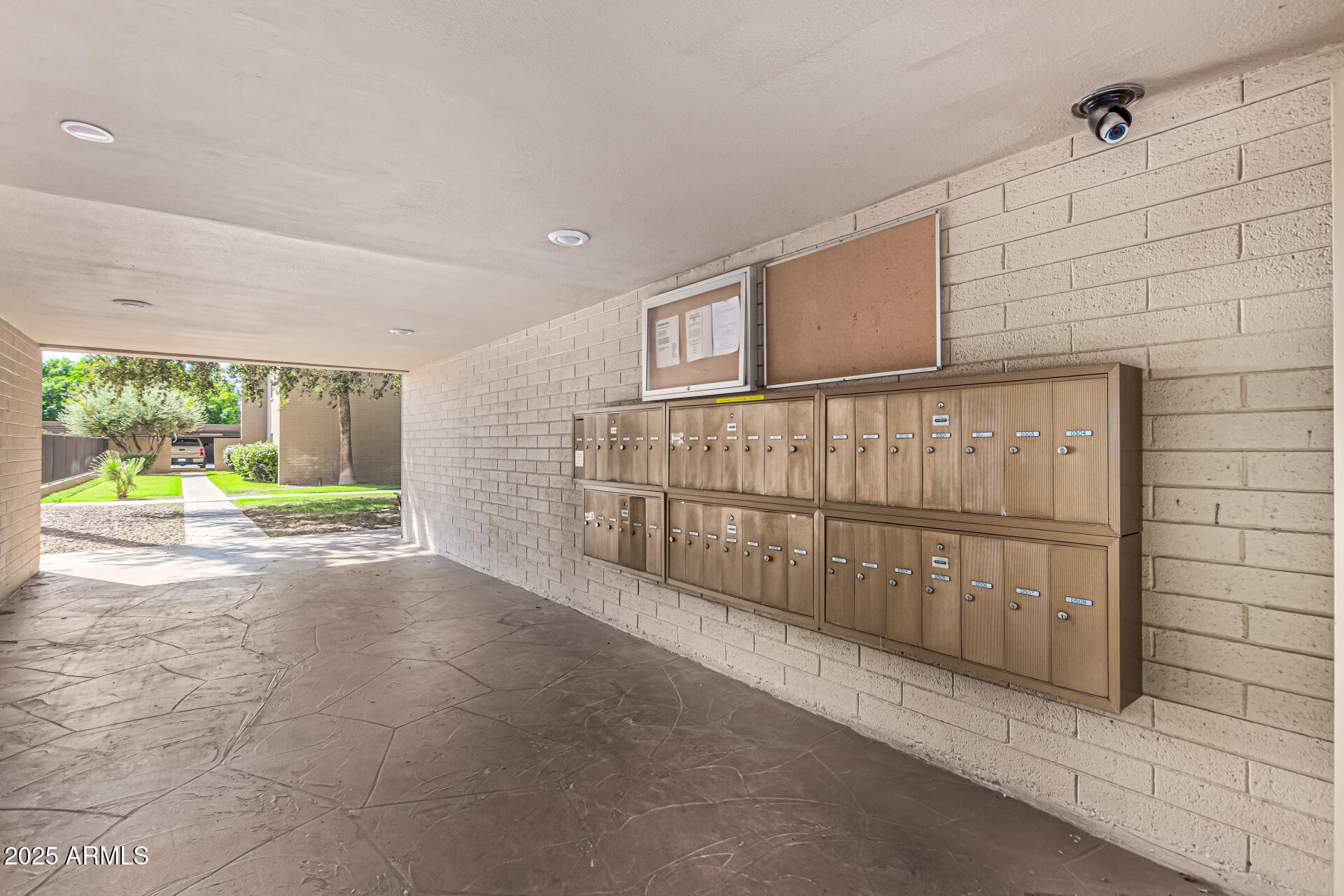 351 East Thomas Road, Unit D505 Phoenix, AZ 85004 - Photo 25 of 28 a view of backyard with large tree and wooden fence
