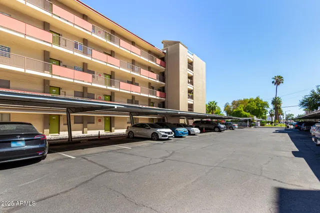 a view of a car is parked in front of a building