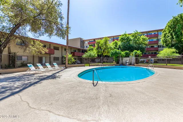 a view of a swimming pool with a patio