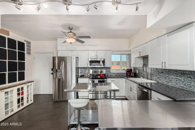 a living room with furniture and flat screen tv